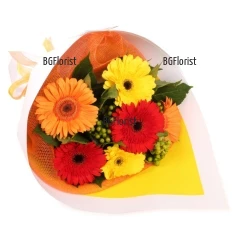 Sunny, bright bouquet of gerberas in different colours and greenery.