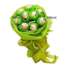Bouquet of luxury chocolates Ferrero Rocher, wrapped in fancy green  papers.