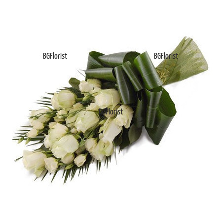 Send bouquet of white roses for  sympathy