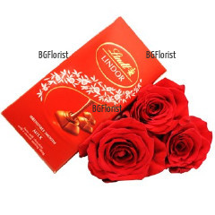 Три прекрасни червени рози, привързани с панделка и вкусен шоколад Lindt.
