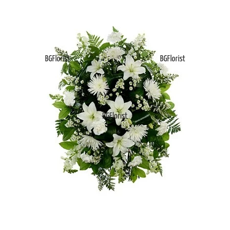 Send Funeral arrangement with white flowers by courier