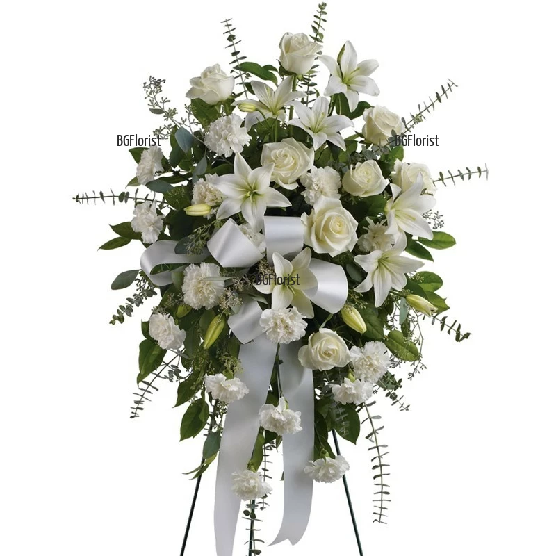 Send Funeral arrangement of mixed flowers