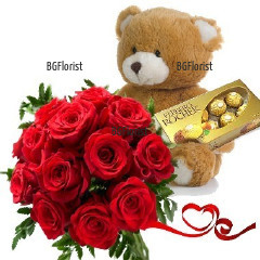 Glamorous gift  for the beloved one - bouquet of red roses and greenery, tied with a ribbon, a Teddy Bear and luxury "Ferrero Rocher" chocolates.