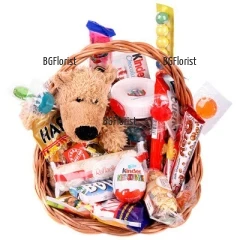 Surprise and delight the child - send this gift basket, arranged with sweets and Teddy Bear.