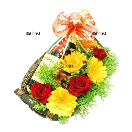 Gift set of flowers and a bottle of red wine