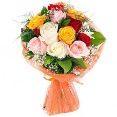 Sunny, charming bouquet of roses in different  colours and greenery, finished with gift paper.