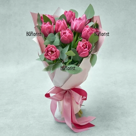 Order bouquet of pink tulips and grenery