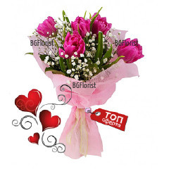 Pretty, tender bouquet of 5 pink tulips in combination with white gypsophila, fresh greenery and fancy paper.