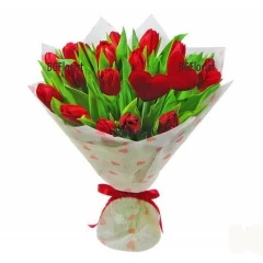 Sensual, magnificent bouquet of red tulips, hearts and fancy papers.