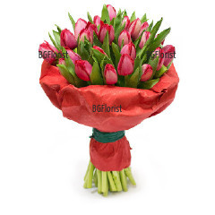 Romantic, sensual bouquet of tulips, wrapped in impressive gift paper.