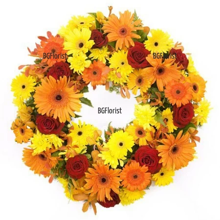 Send a funeral wreath in orange hues to Sofia.