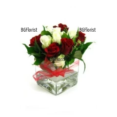 Send an arrangement of roses in glass container by Internet order.