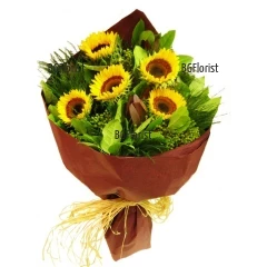 Sunflowers, embraced with a lot of fresh greenery and suitable wrapping. Gently embrace the loved ones with this summer bouquet.