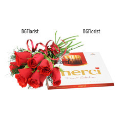 Класически букет от червени рози, малко зеленина и панделка, в комбинация с кутия бонбони Мерси - класика в жанра.