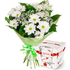 Original gift for friends and relatives - classic bouquet of white chrysanthemums and delicious Raffaello chocolates with delicate coconut filling.