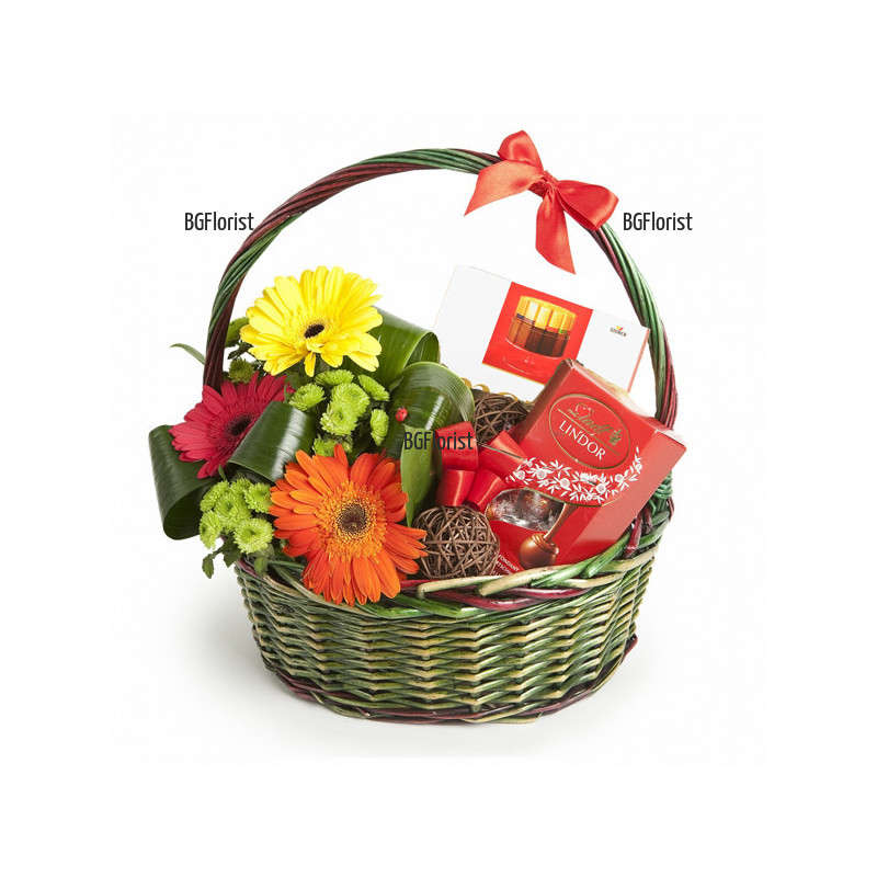 An online order for a basket with flowers and gifts.