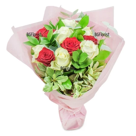 A bouquet of 11 white and red roses