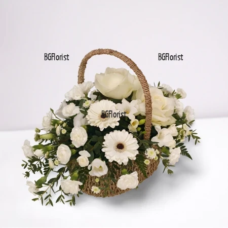 Send basket with white flower by courier.
