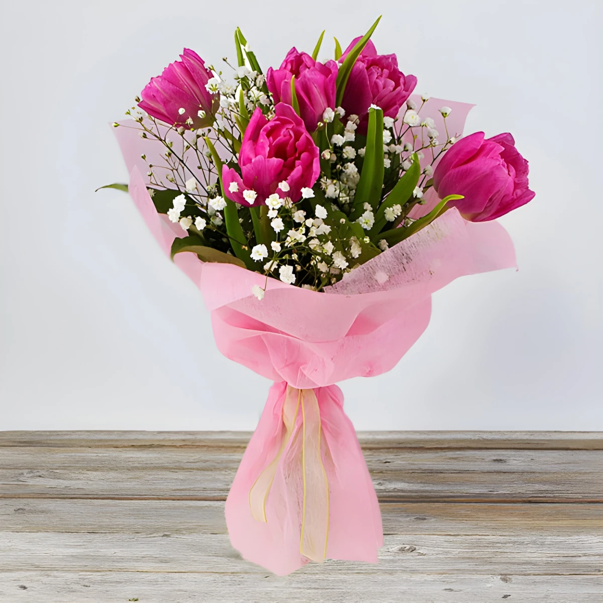 Send bouquet of pink tulips and greenery