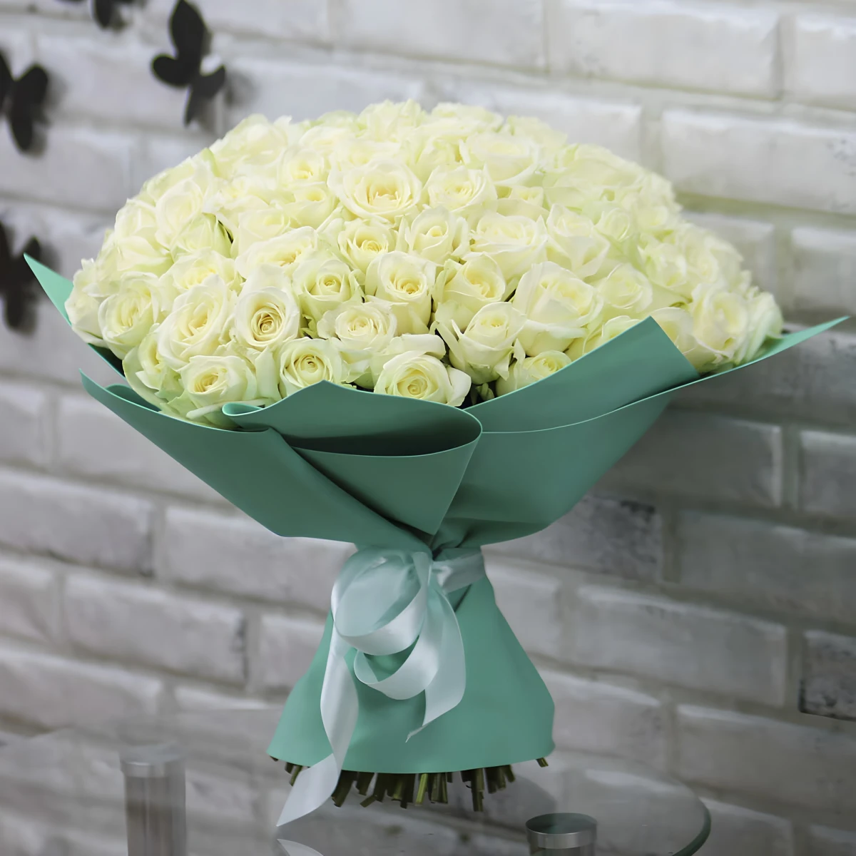Send a bouquet of 101 white roses by courier to Sofia
