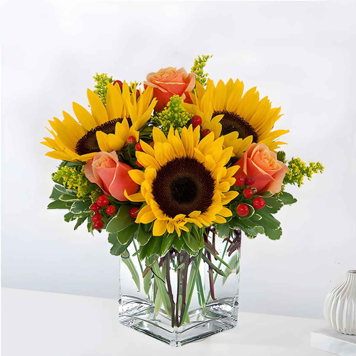 Flower delivery - an arrangement of  sunflowers and roses  to Sofia.