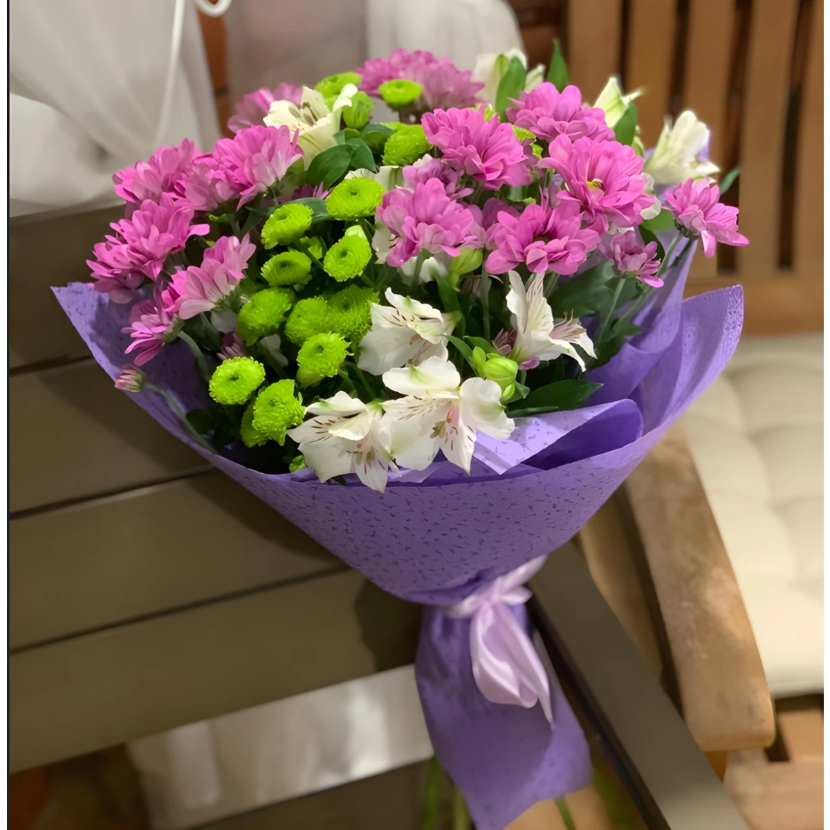 Send a bouquet of various flowers and greenery.