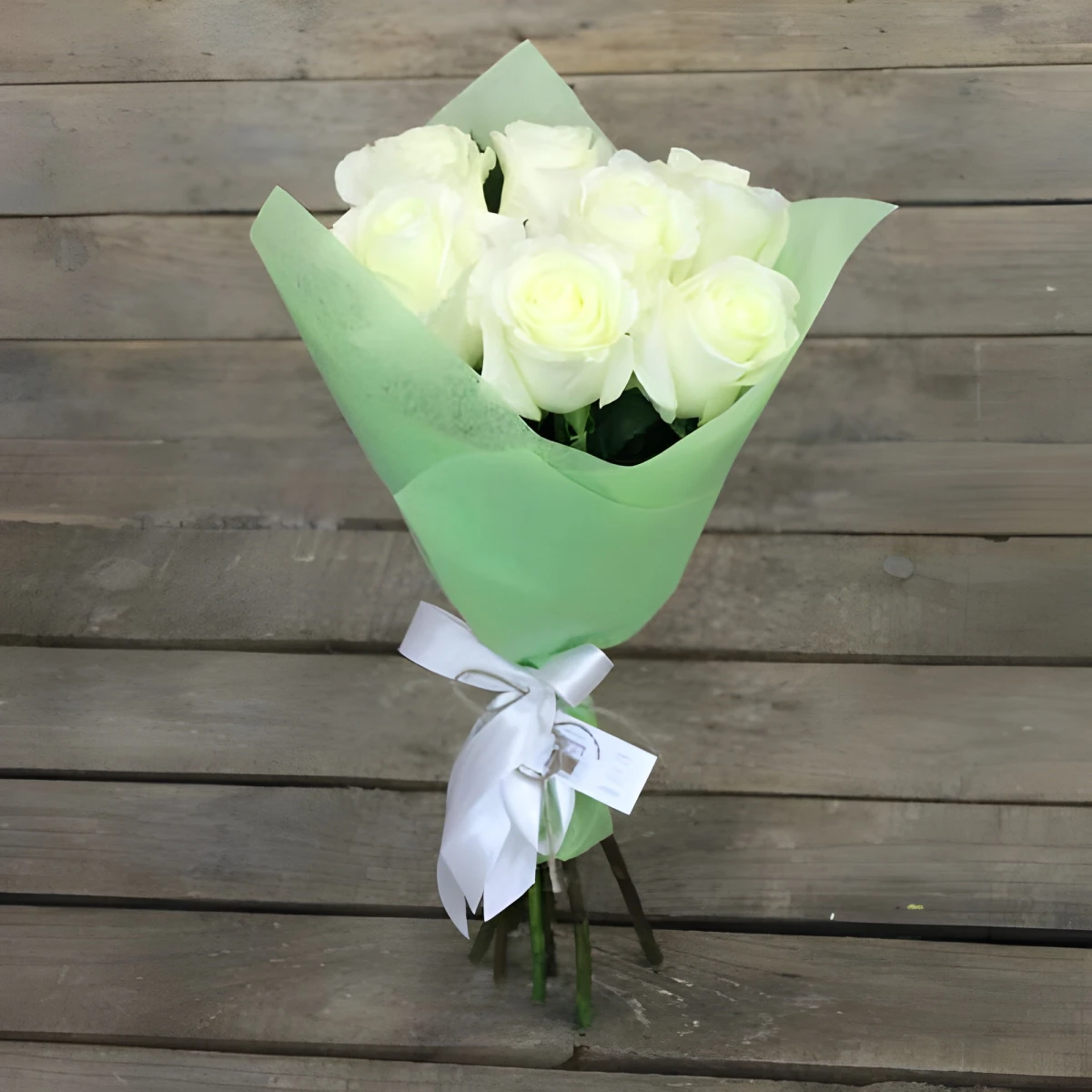 Send to Bulgaria a bouquet of 7 white roses local florist