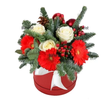 Christmas box with flowers and decoration