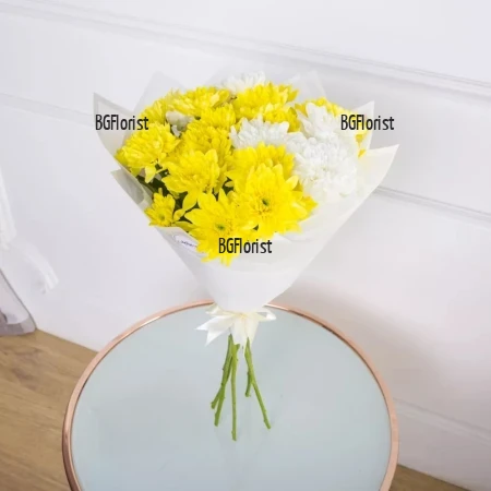 Delivery of a bouquet of yellow and white chrysanthemums