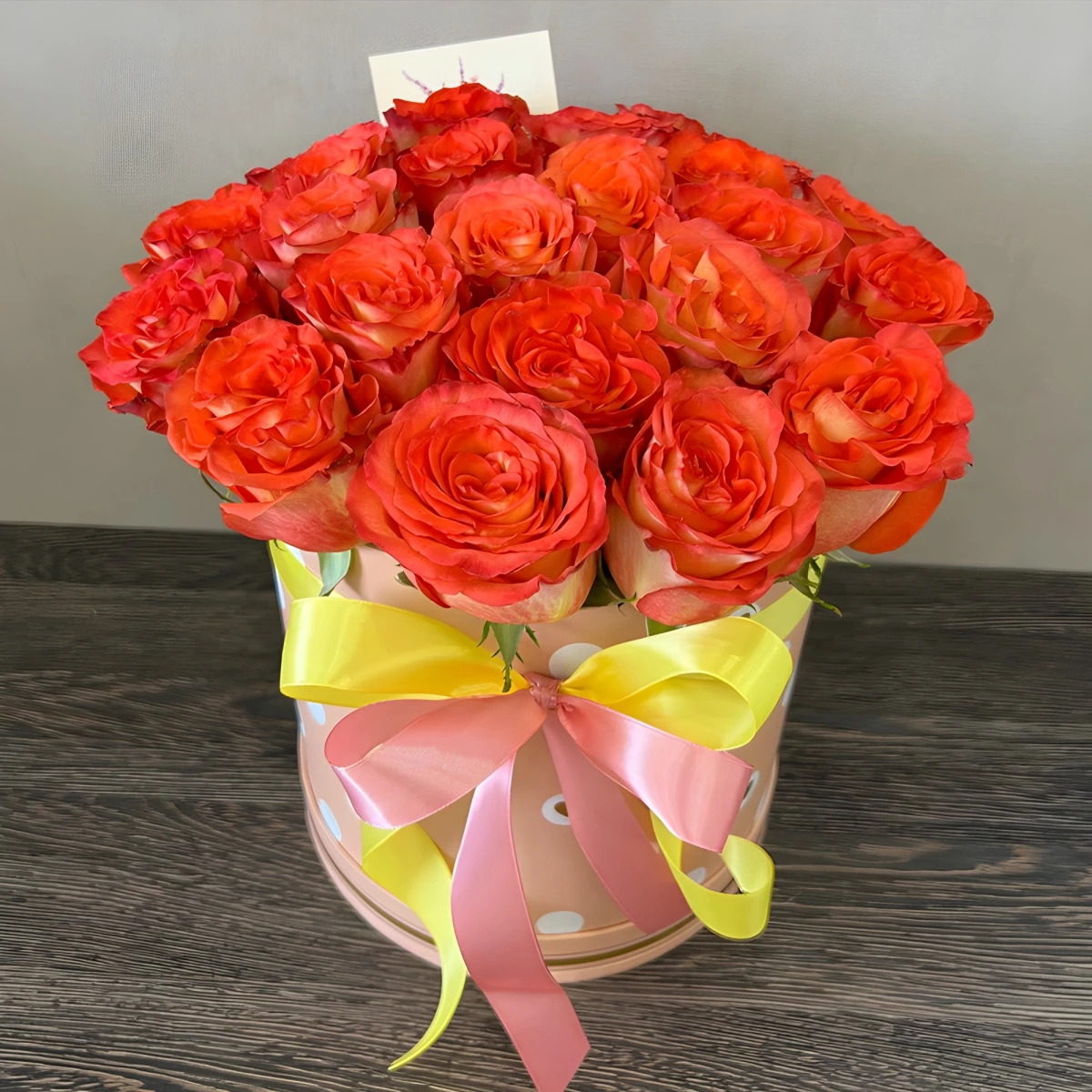 Send 21 orange roses in a round box to Varna Bulgaria