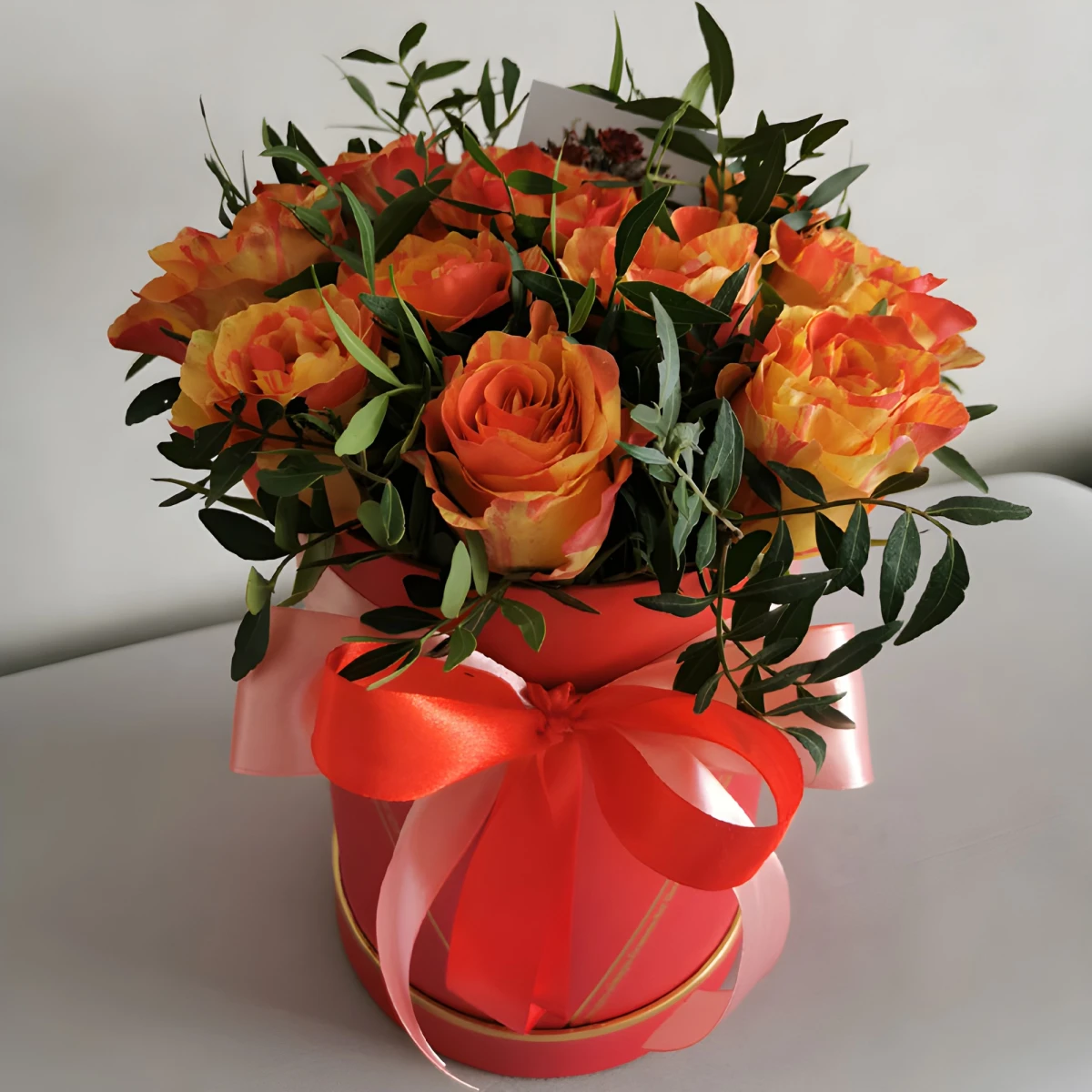 Send to Bulgaria 15 orange roses in a round box